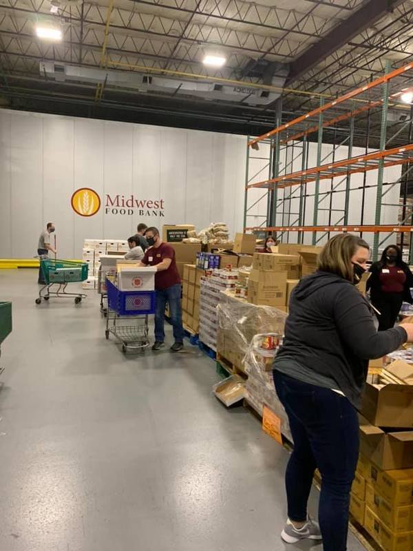 RAS Staff loading food in boxes