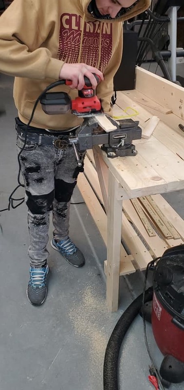 Students in workshop with power tools